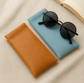 2 Pochettes de voyage en cuir